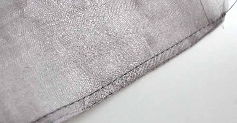 Close up photo of a finished French seam in sheer fabric