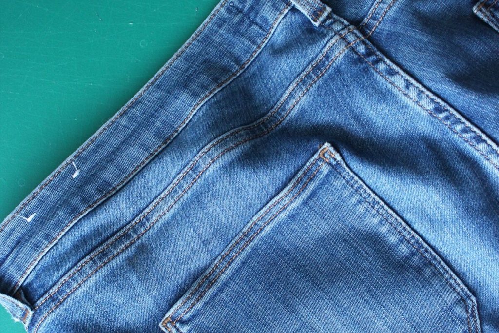 Photo of the the back side of a pair of blue Fat Face jeans used to make a sewing pattern