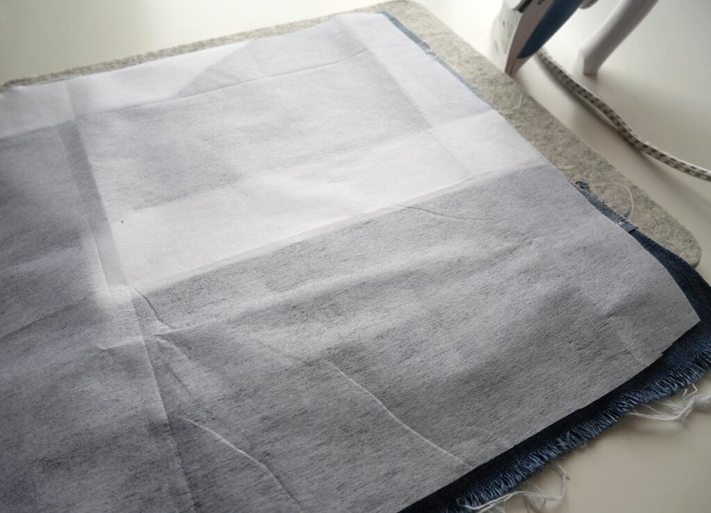Using fusible interfacing to stabilise the denim patchwork panel