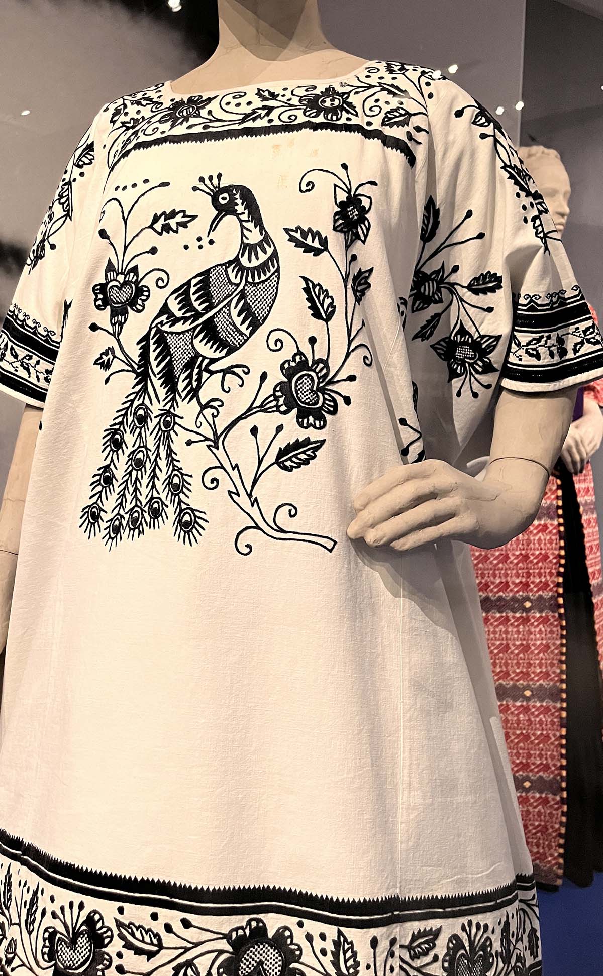 A huipil Frida Kahlo borde, white with embroidered peacocks