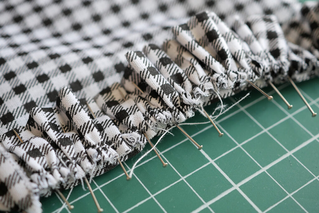 Pin the gathered fabric to where you need it sewing to