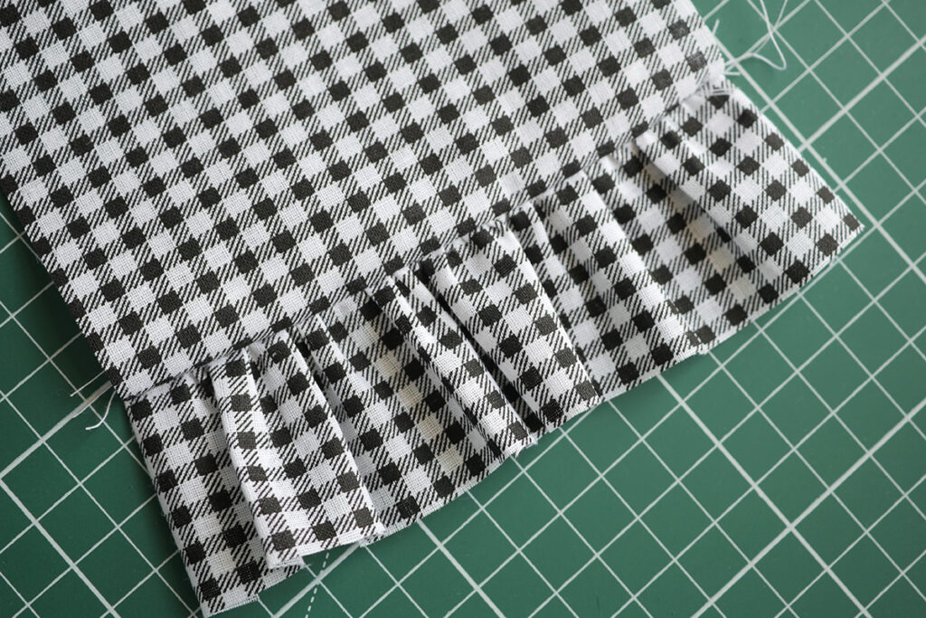 Once the gathering is secured to fabric, press it so that it is neatly finished.