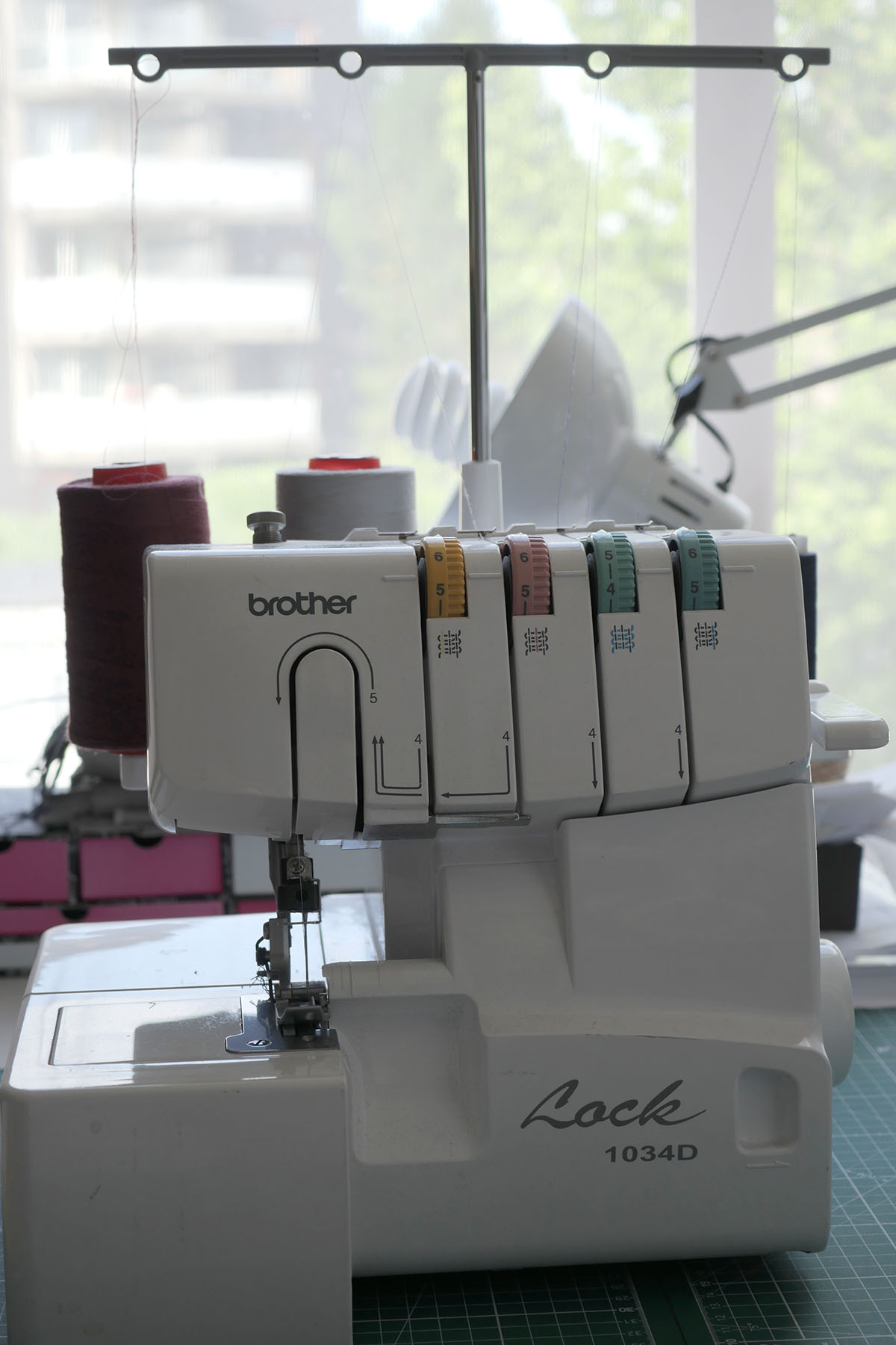Front on photo of a Brother 1034D serger sewing machine