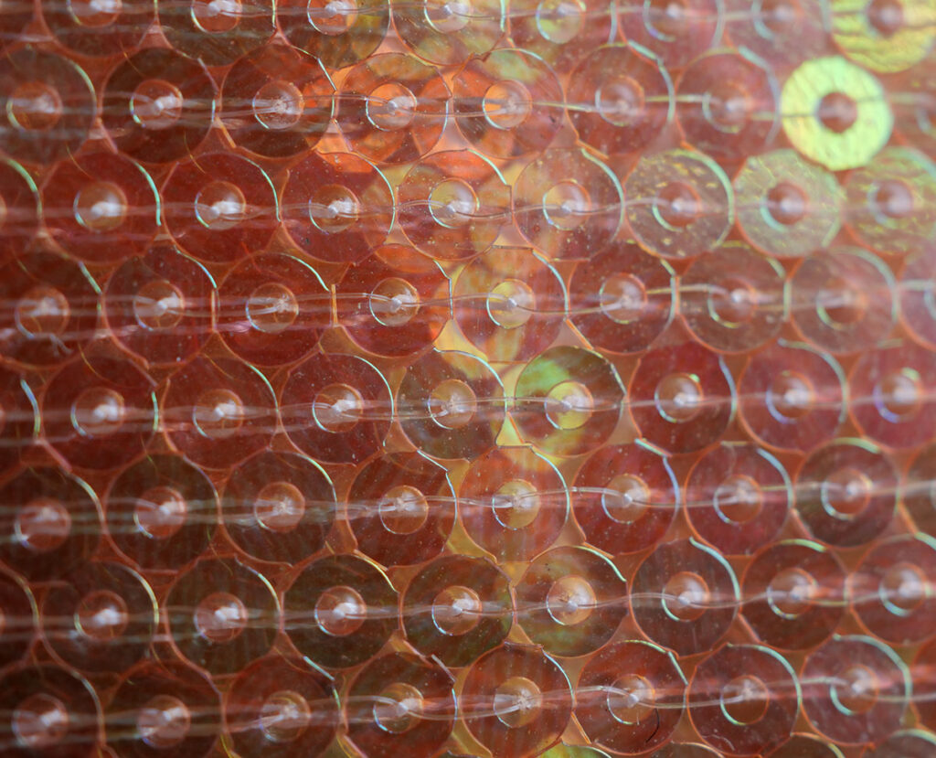 A see through but solid sequin fabric