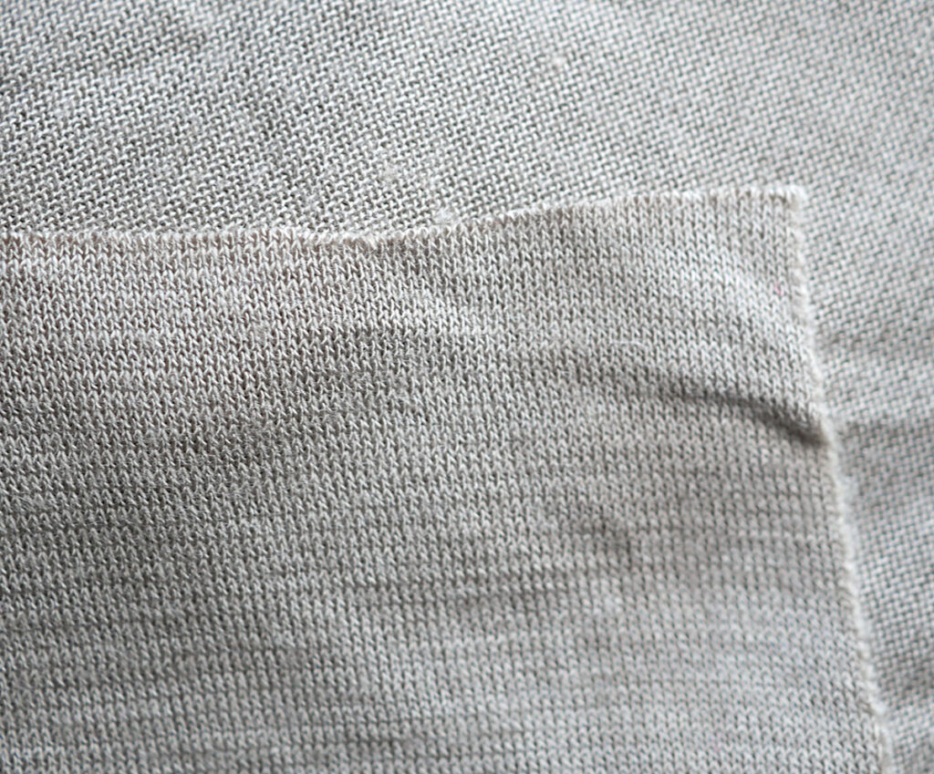 Khaki knit jersey with a mechanical stretch