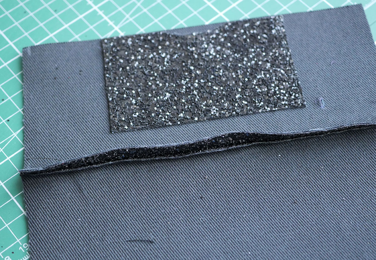 One part of the seam allowance has been trimmed away so that we can stitch down and strengthen the seam