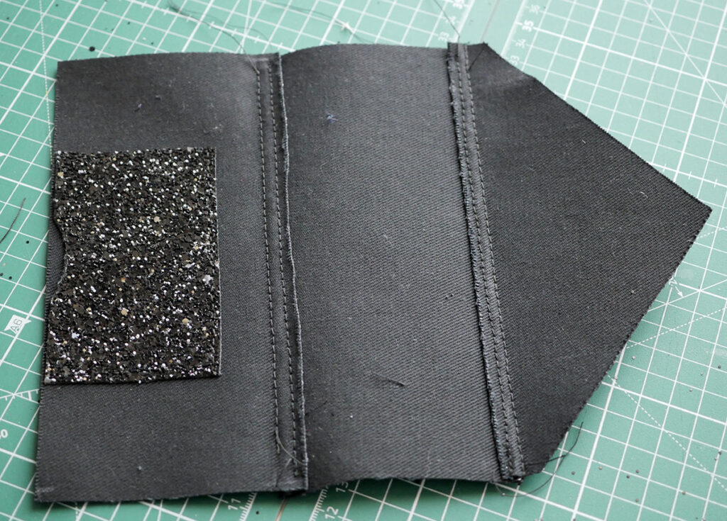 Both main seams are now completed and stitched down to enclose the shorter seam allowance