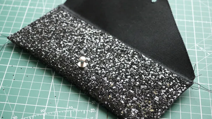 The top stitched sides of the wallet are only just visible