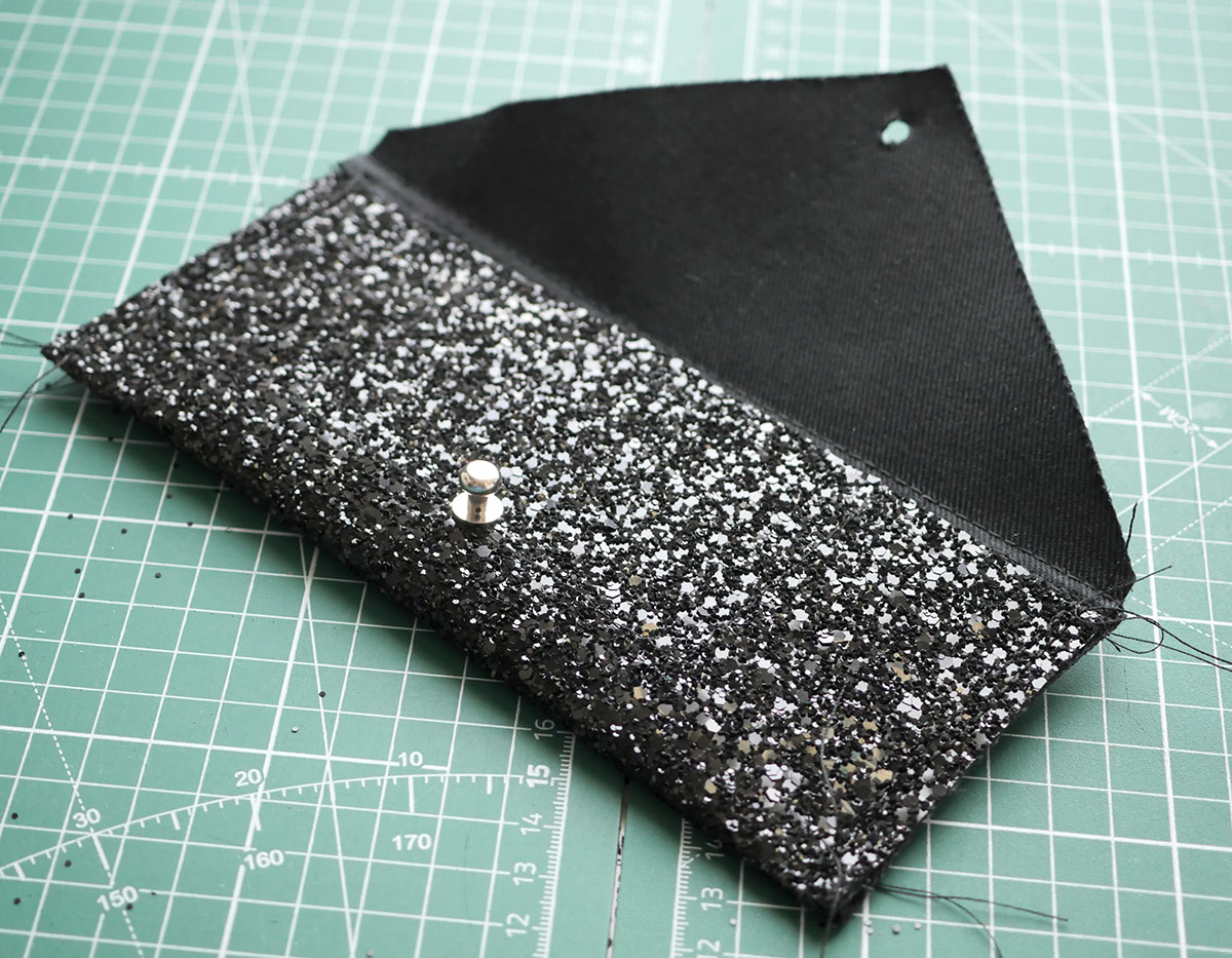 The top stitched sides of the wallet are only just visible