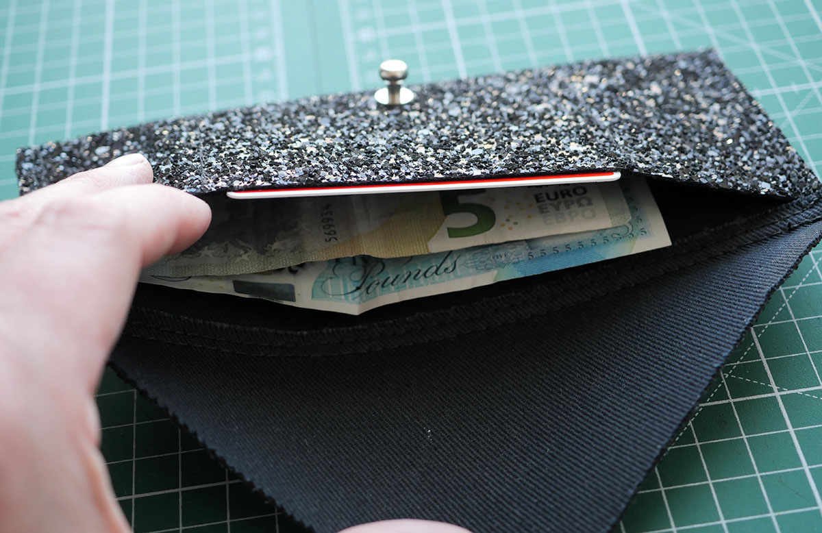 I love this larger wallet - it fits notes and bills perfectly without the need to fold them!