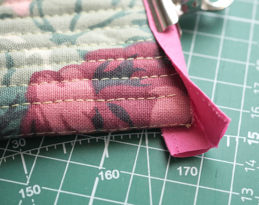 Just enough bias tape scrap to bind the edge of my DIY quilted glasses case