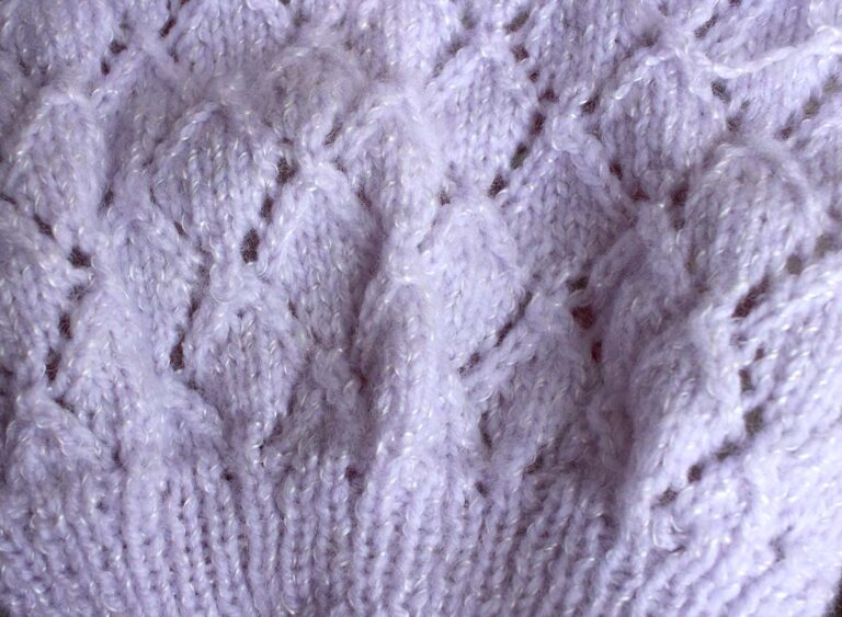 Sample of hand knitting in pale lilac