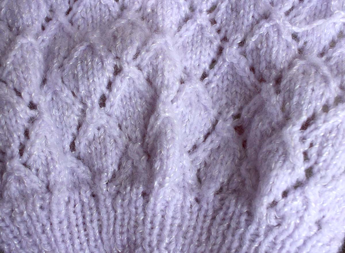 Sample of hand knitting in pale lilac