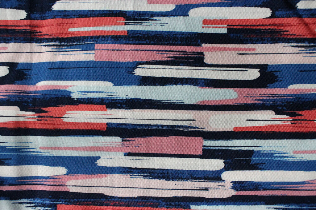 A medium weight cotton fabric in dark tones