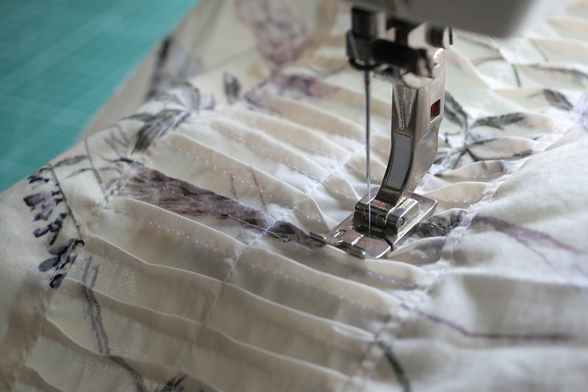 Sewing directional pin tucks