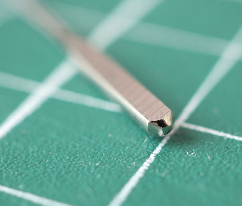 The butt is the very blunt end of the sewing machine needle, found at the top