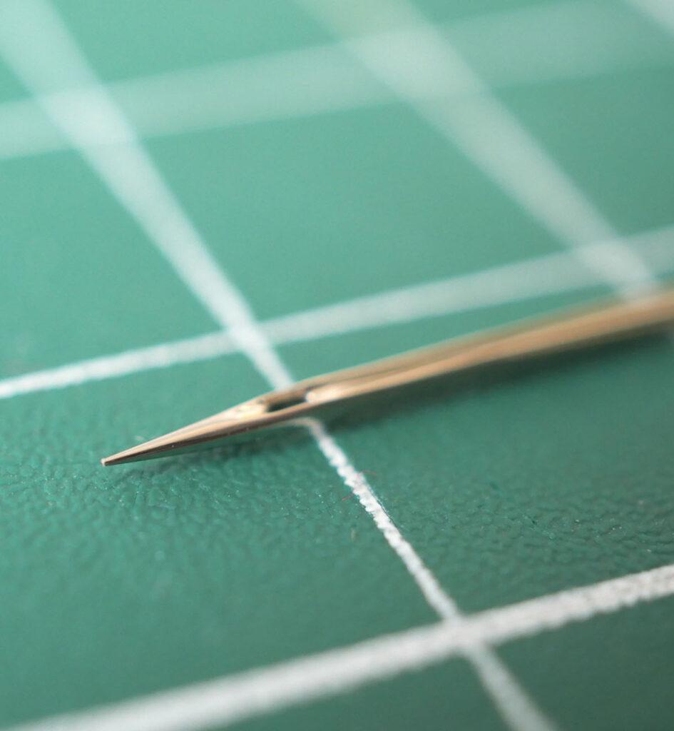 The eye of the sewing machine needle