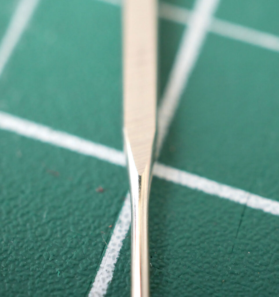All sewing machine needles have 'shoulders, which are the curved shape joining the 'shank' to the 'blade' of the needle