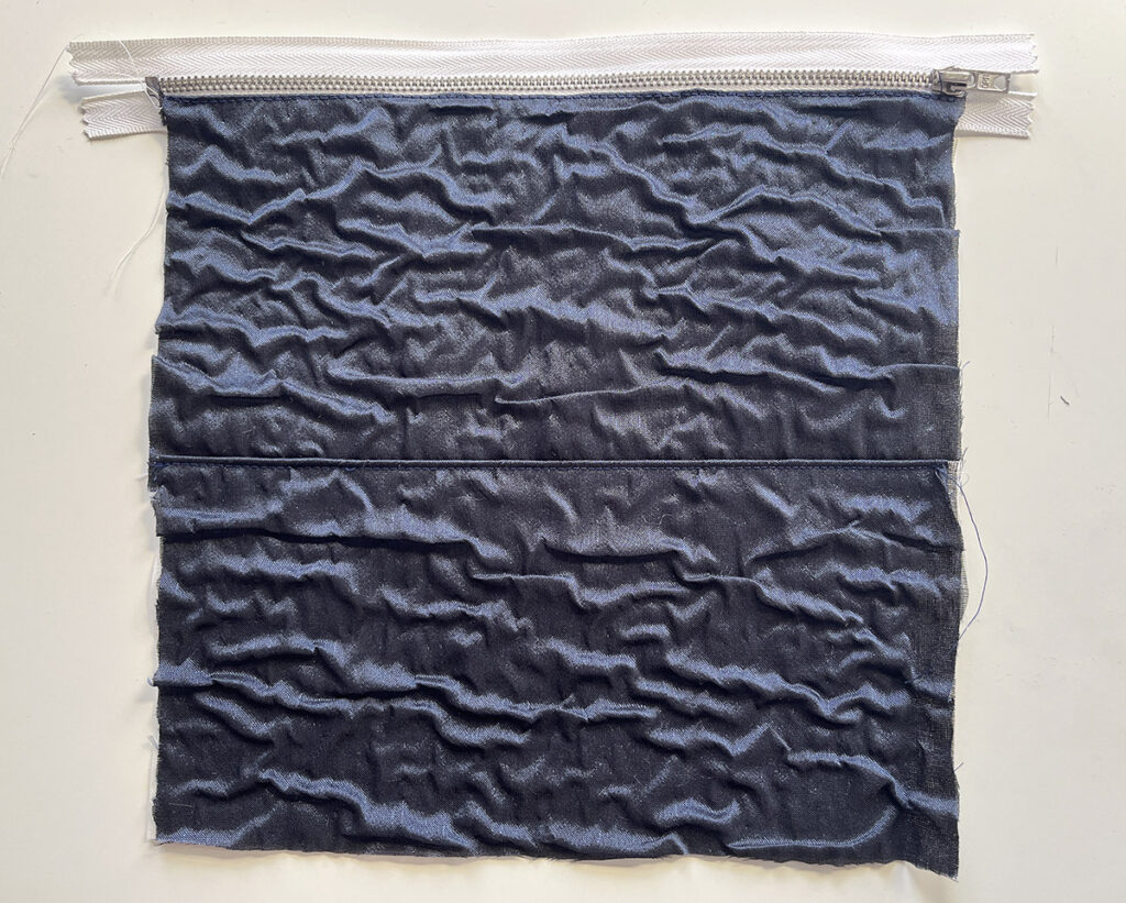 A line of topstitching helps to keep the zipper nicely in place.