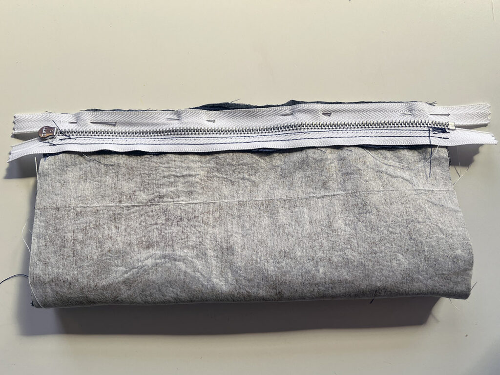 Line up the shorter edges, and pin the zipper to the opposite side of your DIY pencil case