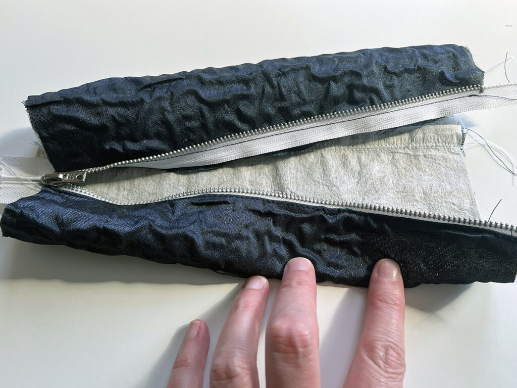 Sew the zipper into place on your DIY pencil case