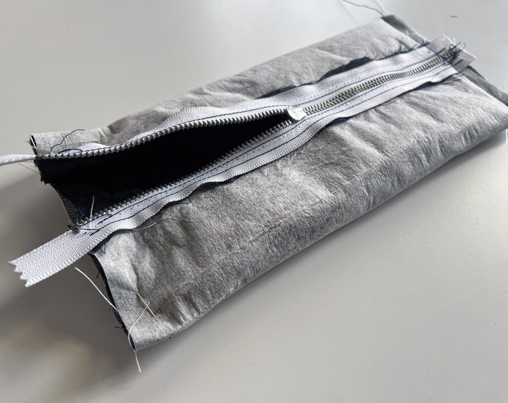 Make sure the zipper is open before sewing the final short edge of your DIY pencil case!