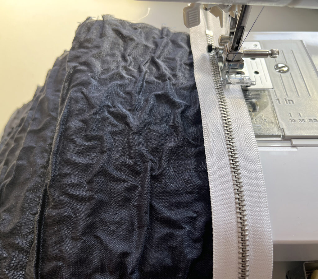 Baste the zipper with a long stitch length if you prefer