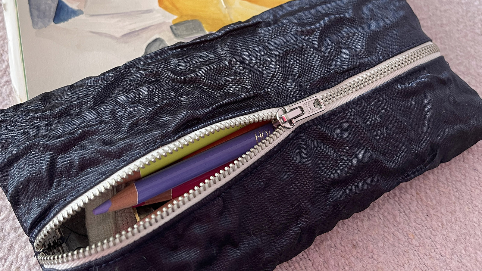 The finished DIY pencil case with pencils inside, using my tutorials on how to make a pencil case