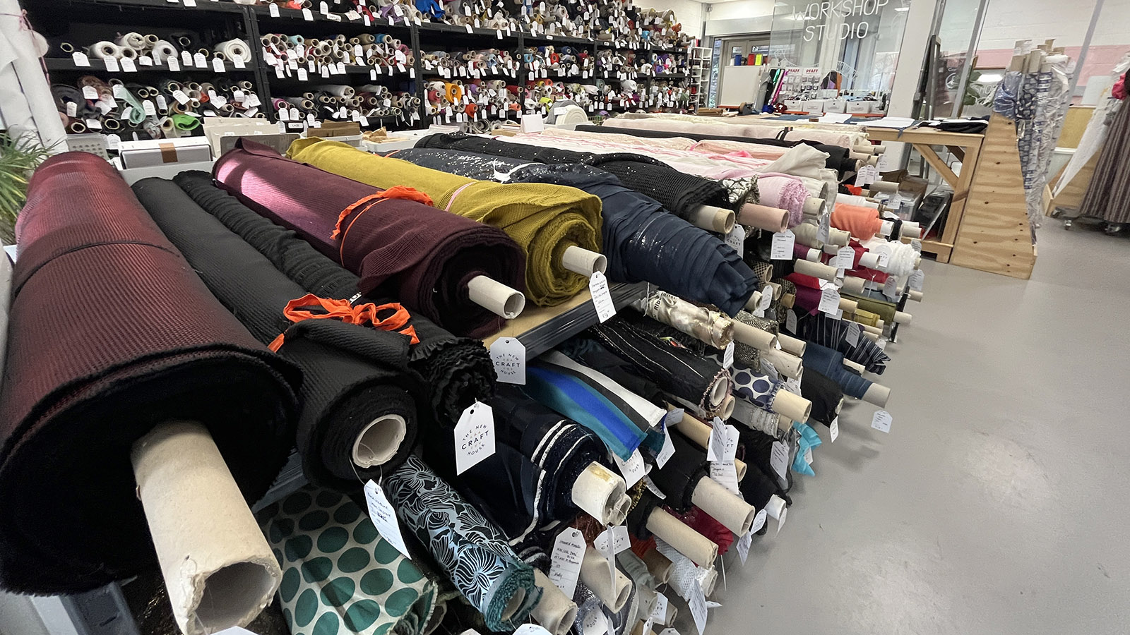 Bolts of fabric at The New Craft House Hackney - a fabric shop and studio in Hackney, London