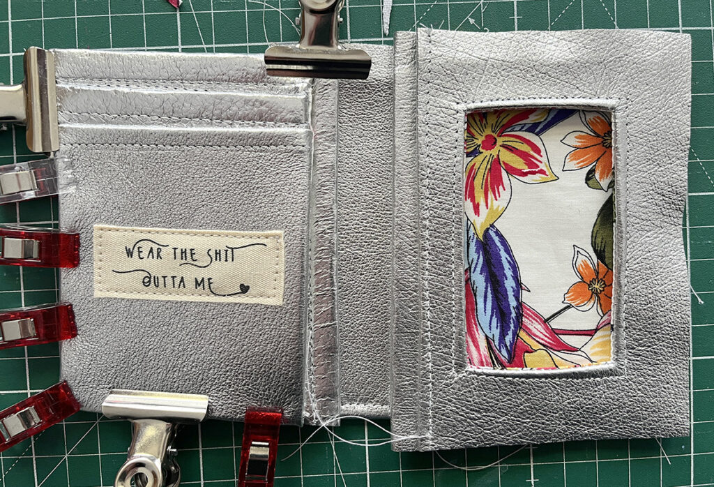 Silver leather wallet almost sewn up