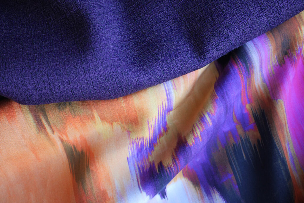 The abstract drapey fabric with purple woven fabric