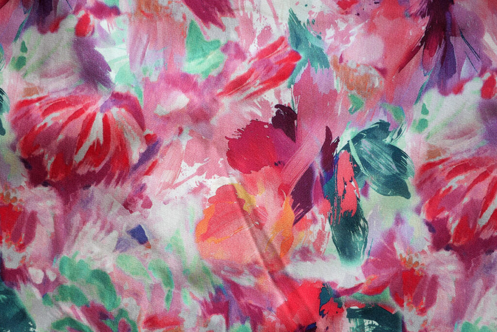 Gorgeous floral French Terry fabric with pinks, purples and orange