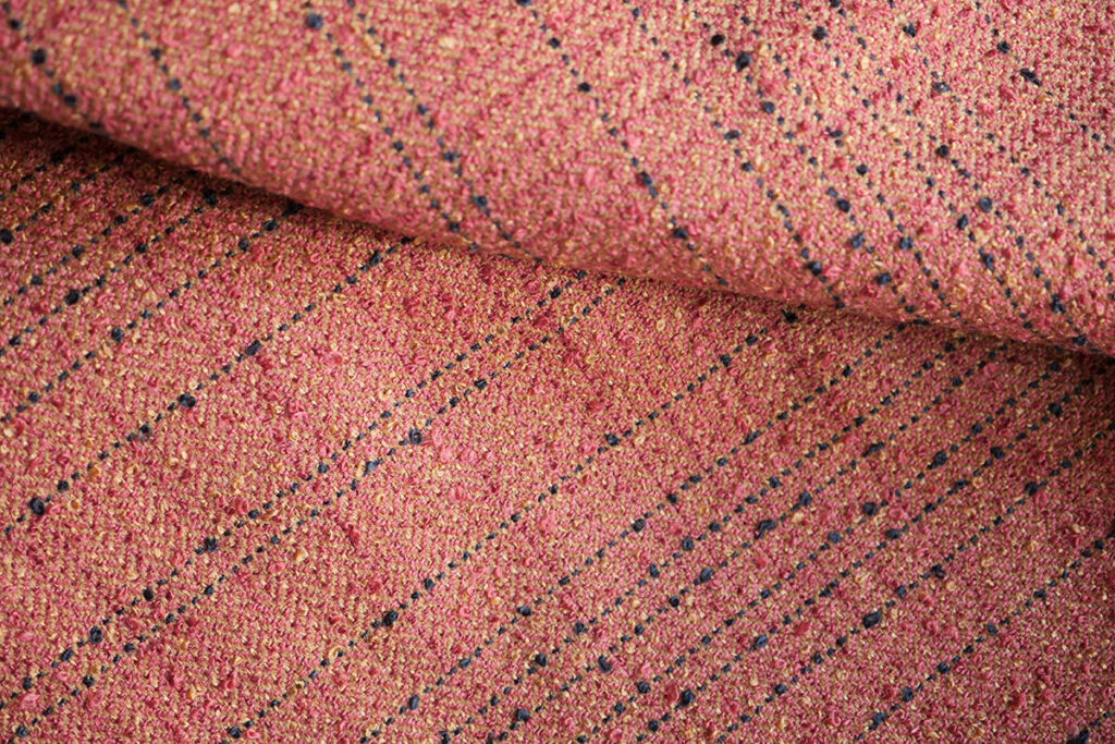 An orange tweed-like woven fabric