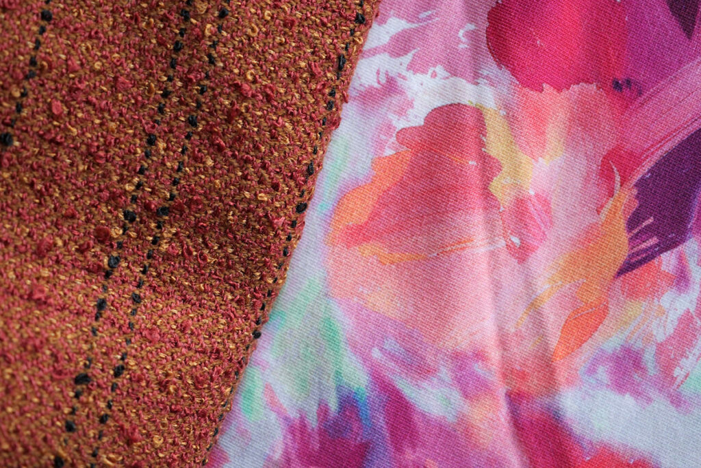 The orange woven fabric with the floral French terry