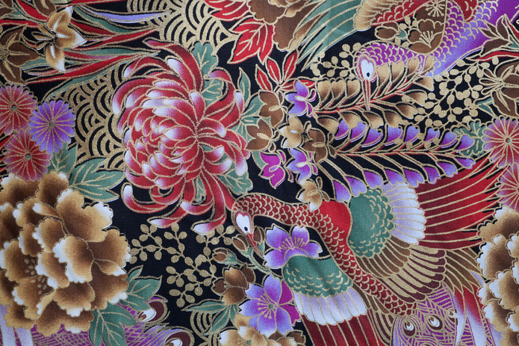 A woven cotton with printed peacocks
