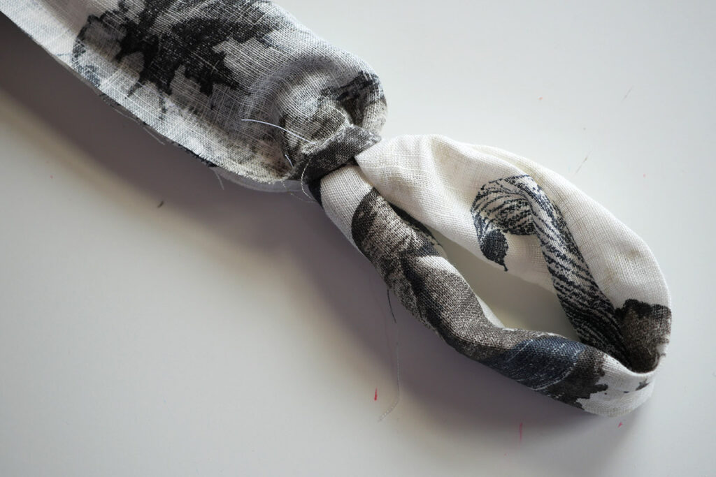 Gently pull the fabric tube out via the gap that was left