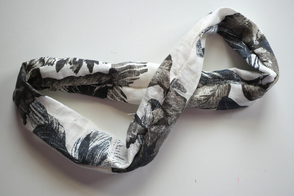 The tube of fabric is pulled through and right sides out.