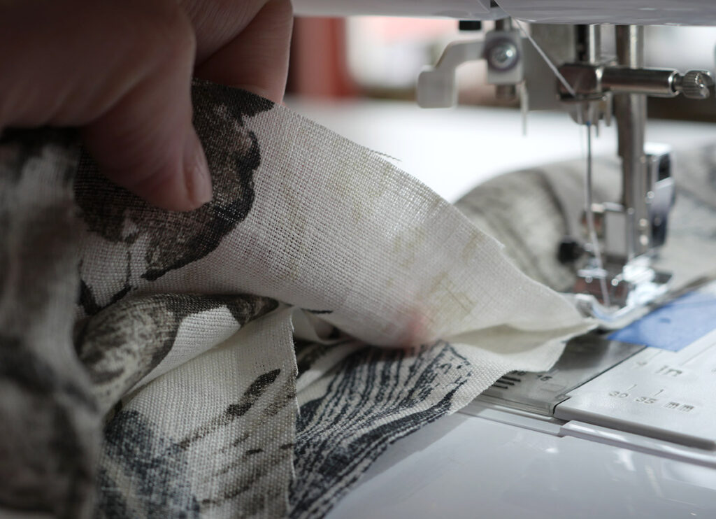 Sewing the tube of fabric that will become the hair scrunchie